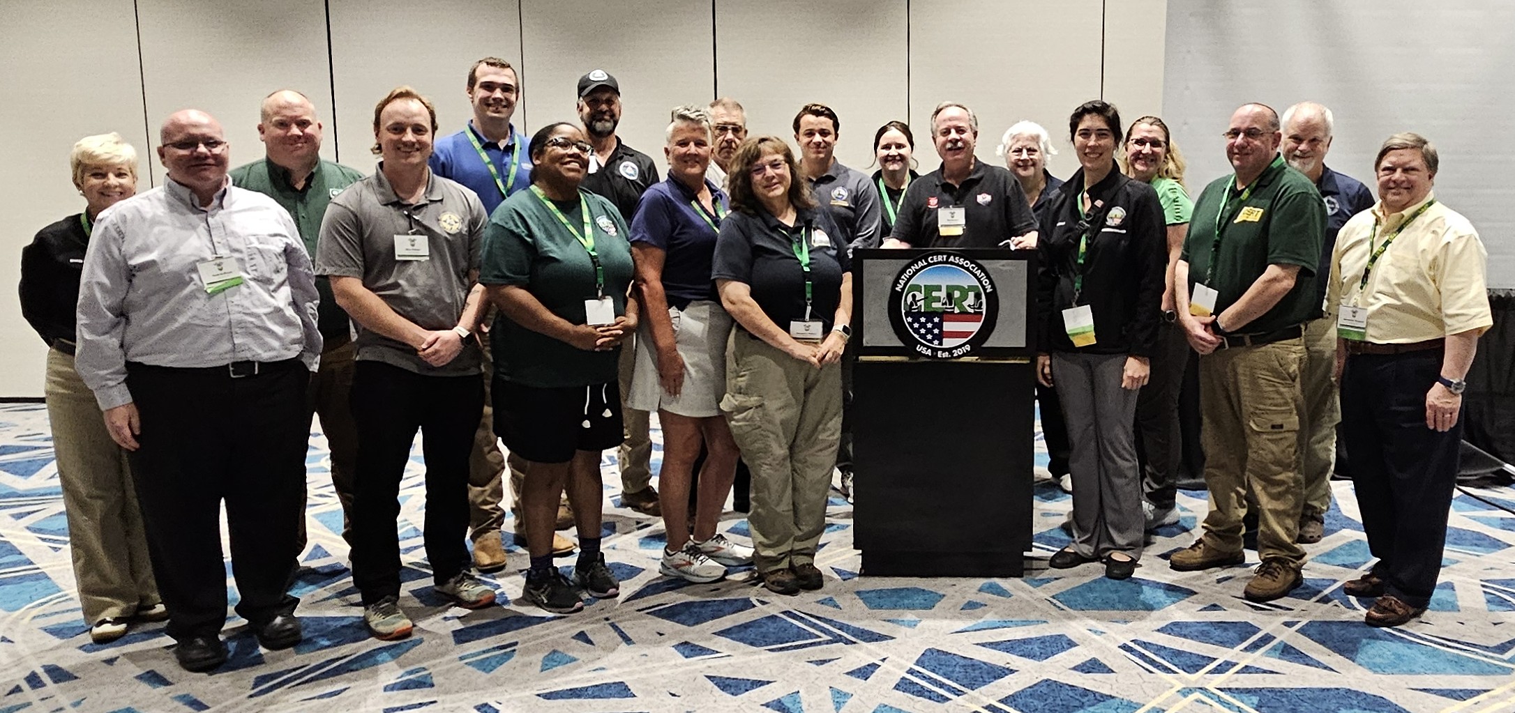A group of people standing together near a podium posing for a picture